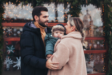Fototapeta premium family walk with baby before christmas