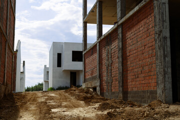 A multi-storey building made of monolithic and red brick