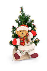 Teddy bear in Santa Claus costume hanging ornaments on the small Christmas tree isolated on white background.
