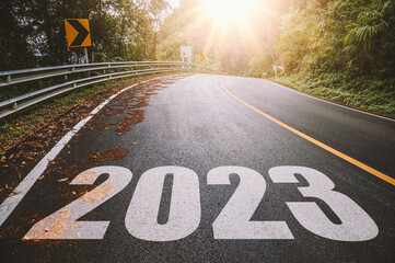 Empty asphalt road with New year 2023 concept. Direction to new year concept and sustainable development idea for goal and success.	

