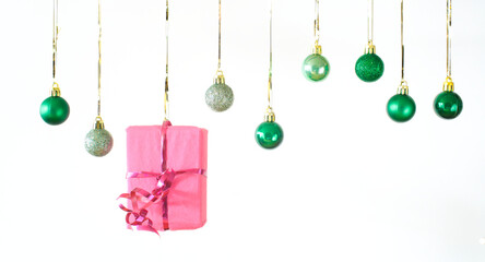 christmas balls in a row, wrapped present, on white background, merry christmas,free copy space