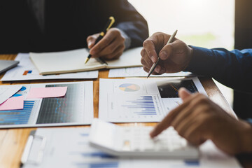 Businessman meeting and working with financial report for analysis data figures to plan business...