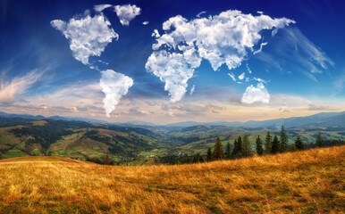 clouds in the form of a map of the world over the mountains. autumn dawn in the Carpathians. Travel and landscape concept 