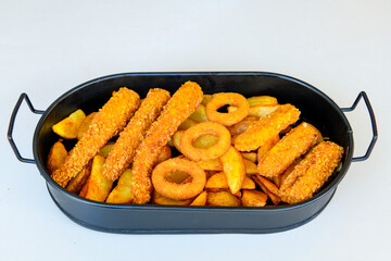 Fried Chicken breast hot crispy strips crunchy chicken tenders  isolated on white background.Nuggets isolated on white background on a plate