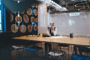 Businesswoman speaking on mobile phone and smiling
