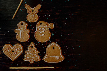 christmas tree made of gingerbread on a wooden background. dish for children
