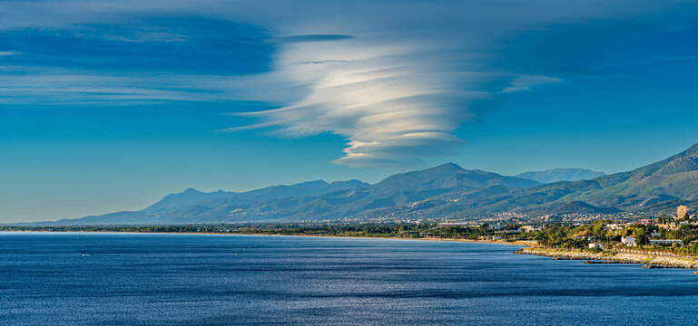 Bastia, Corsica, France, September 07, 2022 – Dramatic lenticular cloud formation over the mountains near Bastia