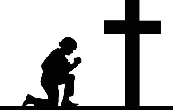 Soldier Praying at Memorial Cross