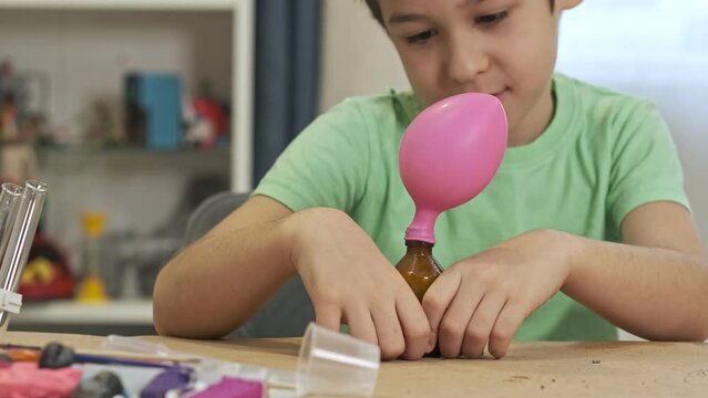 boys cientist doing experiments. Education concept. Preschooler interests. Smart little child doing chemical research at home laboratory. Dangerous experiment. Home activities for children.