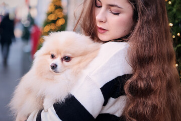 young girl with spitz dog