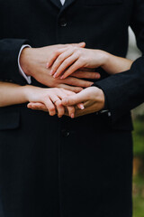 Obraz premium Hands, fingers of the bride and groom, man and woman together close-up.