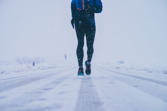 Man running in winter on the snow