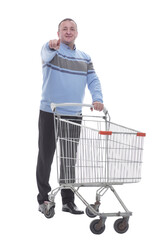 in full growth. confident casual man with shopping cart