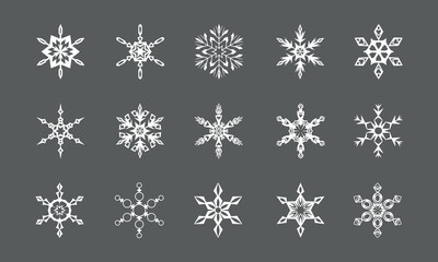 Hand drawn snowflakes set. White shapes on gray background. Winter decor collection. Vector illustration.