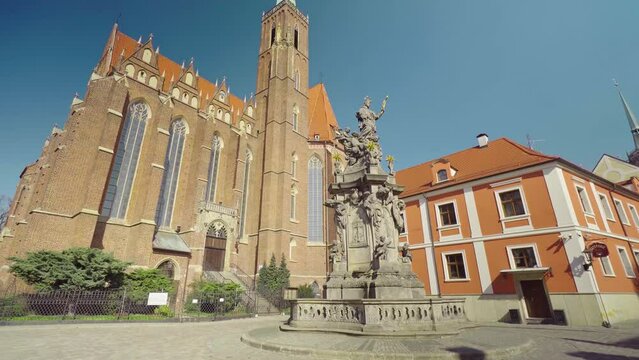 View of the Collegiate Church of the Holy Cross and St Bartholomew in Wroclaw on Ostrow Tumski. Old town, Poland, church, architecture, Roman Catholic, gothic, neo-gothic, gimbal. 4K Video Footage.