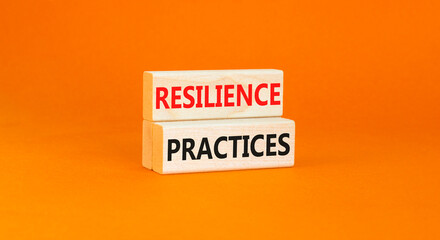 Resilience practices symbol. Concept word Resilience practices typed wooden blocks. Beautiful orange table orange background. Business and resilience practices concept. Copy space.
