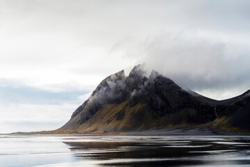 The striking Iceland landscape with clouds and mountains.