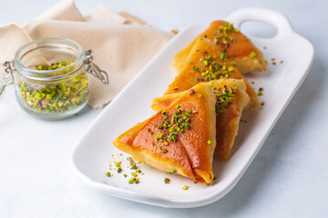 Traditional Turkish desserts; custard triangular dessert, albanian dessert ( Turkish name; Arnavut tatlisi or muhallebili muska tatlisi)