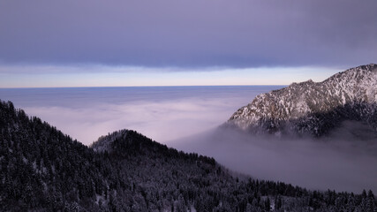 clouds over the winter mountain valley