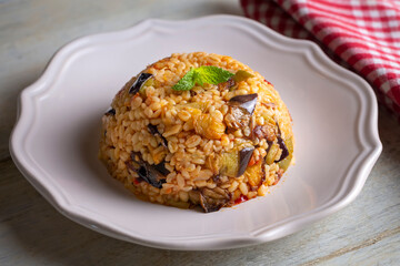 Traditional delicious Turkish food; Bulgur pilaf with eggplant and vegetables. (Turkish name; Patlicanli bulgur pilavi)