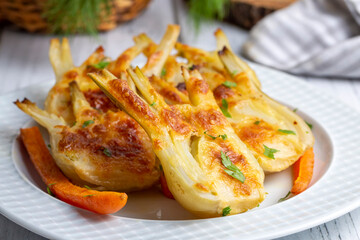 Roasted Fennel with Cheese. Sliced fennel oven roasted in olive oil. - obrazy, fototapety, plakaty