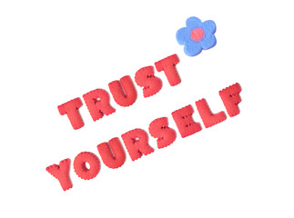 The word TRUST YOURSELF spelled with red alphabet cookies and blue marshmallow candy on transparent background, png file