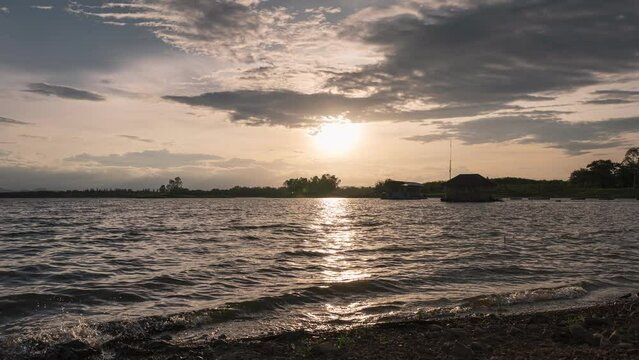 Sunset over Huai Mai Teng natural reservoir in countryside at Ratchaburi