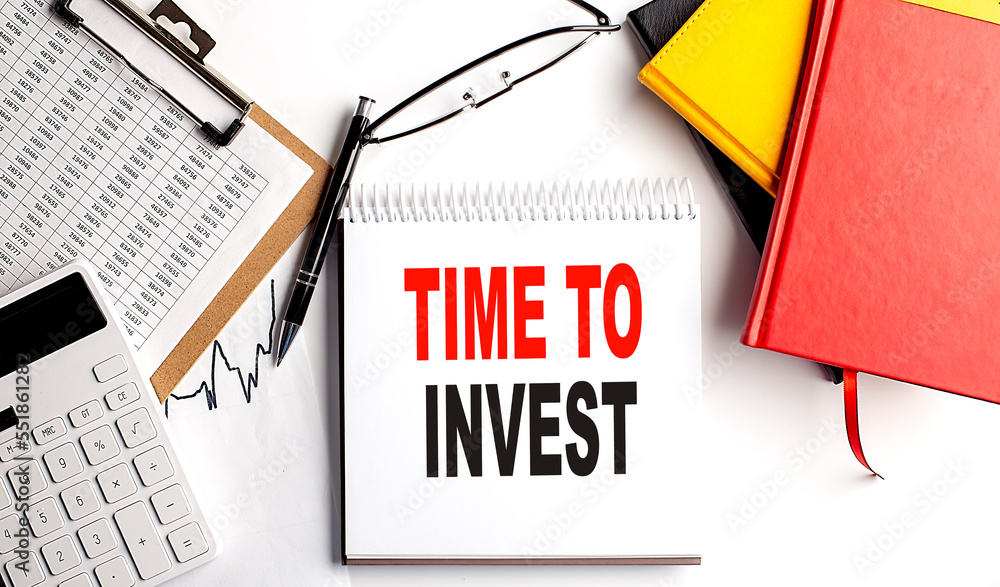 Poster time to invest text on notebook with clipboard and calculator on white background