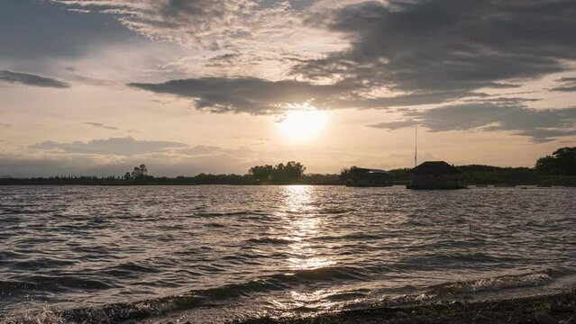 Sunset over Huai Mai Teng natural reservoir in countryside at Ratchaburi