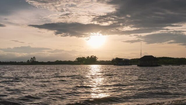 Sunset over Huai Mai Teng natural reservoir in countryside at Ratchaburi