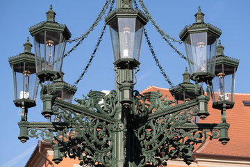 Fototapeta na wymiar Detail of the Old lantern gas lamp candelabra on Hradcany Square in Prague