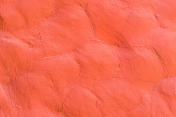 Red paint on the stone surface wall texture background