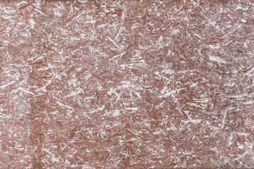 Brown and white surface paint on the press wood texture of the chipboard background