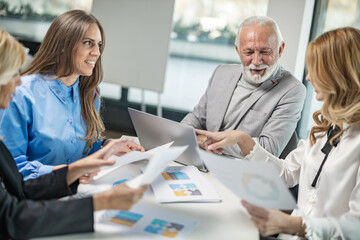 Business people on the meeting, four people excanging their expiriences
Blonde woman model