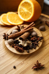 Spices for making mulled wine in a wooden bowl