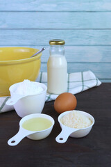 Ingredients for baking pao de queijo, a popular Brazilian cheese bread on wooden table