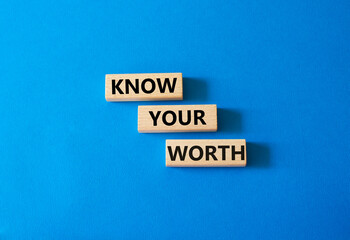 Know your worth symbol. Wooden blocks with words Know your worth. Beautiful blue background. Business and Know your worth concept. Copy space.