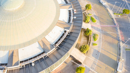 Aerial view at sunset of the Palazzo dello Sport in Rome (also called PalaSport or PalaEur), a building in the EUR district around the lake. The structure hosts sport events, conventions and concerts.