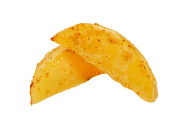 Fried potato wedges on a white plate close-up. Potato isolate