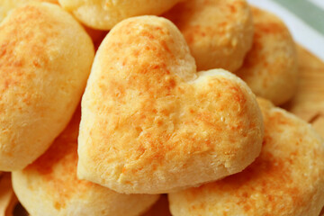 Closeup of Delectable Heart Shaped Freshly Baked Pao de Queijo or Brazilian Cheese Bread