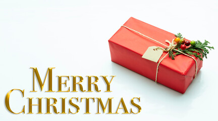 Christmas decoration. Text in golden letters wishing Merry Christmas.