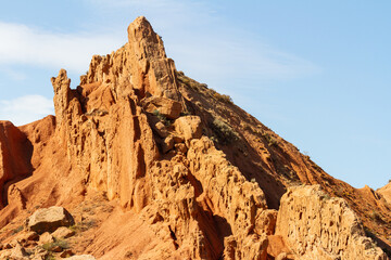 Fototapeta premium Fairytale canyon or Skazka Canyon, Natural park of colorful rocks near Issyk-Kul lake, Kyrgyzstan.