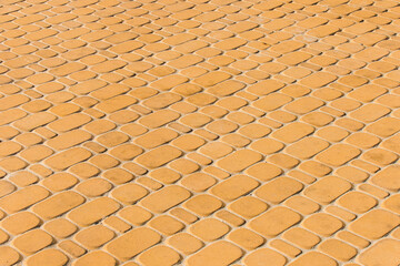 Light orange or yellow stone paving slabs floor tile urban texture background