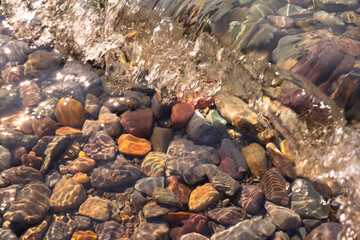Waves Crashing Over Lake McDonald Rocks in Glacier National Park, Montana, USA