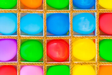 Multicolored bright colorful vibrant balloons background for playing darts game