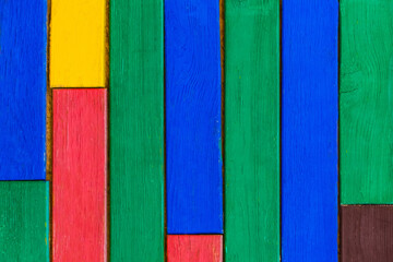 Multicolored colorful painted wood texture, colored plank fence surface board background