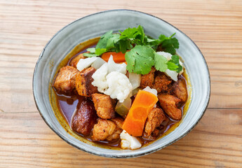 Pica pau traditional portuguese food spicy pork stew dish. Top view in certamic plate
