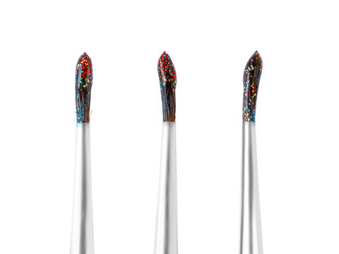 Set of three wet brushes with colored glitters. Png isolated with transparency