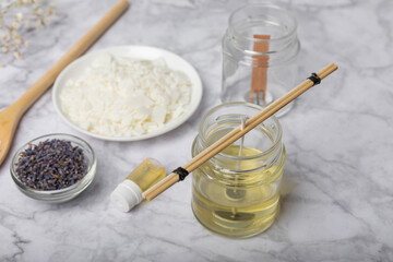 Basic set for homemade natural white eco-friendly soy wax candles in glass, wick, perfume on white marble. Hobby, business. Making candles with your own hands.Vegan product. Copy space.