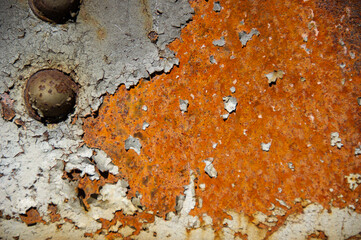 Sheet Metal with bolt and peeling paint.